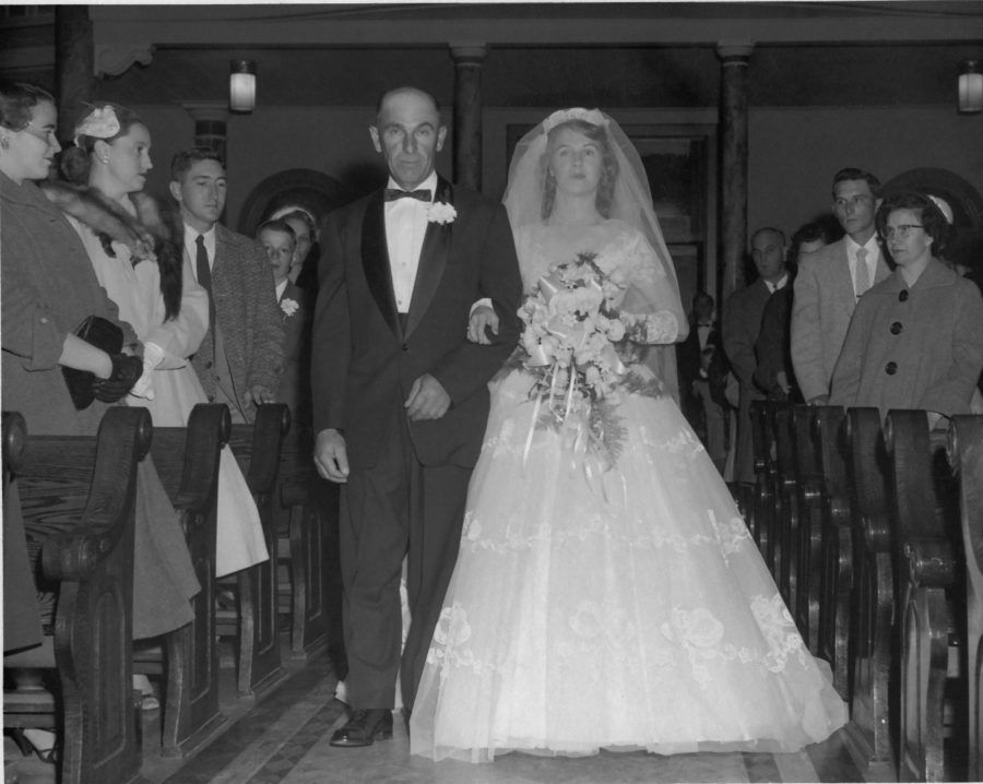 Father Walking Marian Down Aisle